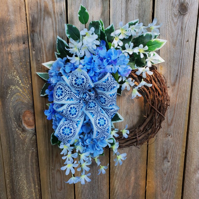 blue hydrangeas with blue on white denim bow